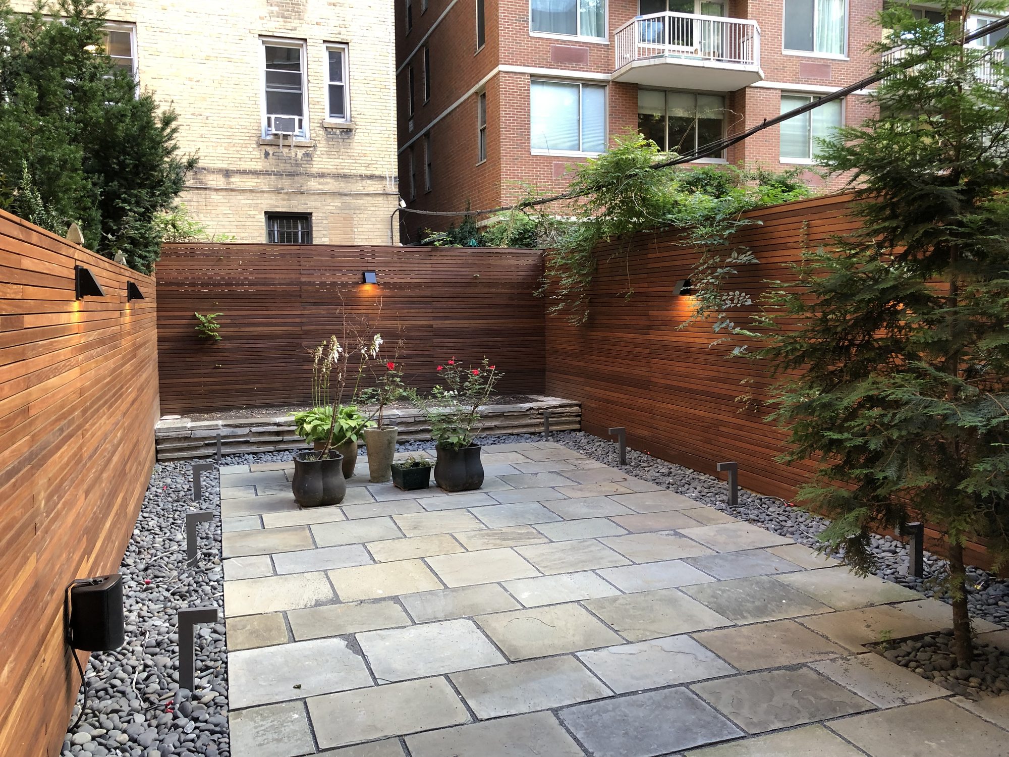 NYC bluestone courtyard with cedar privacy fence